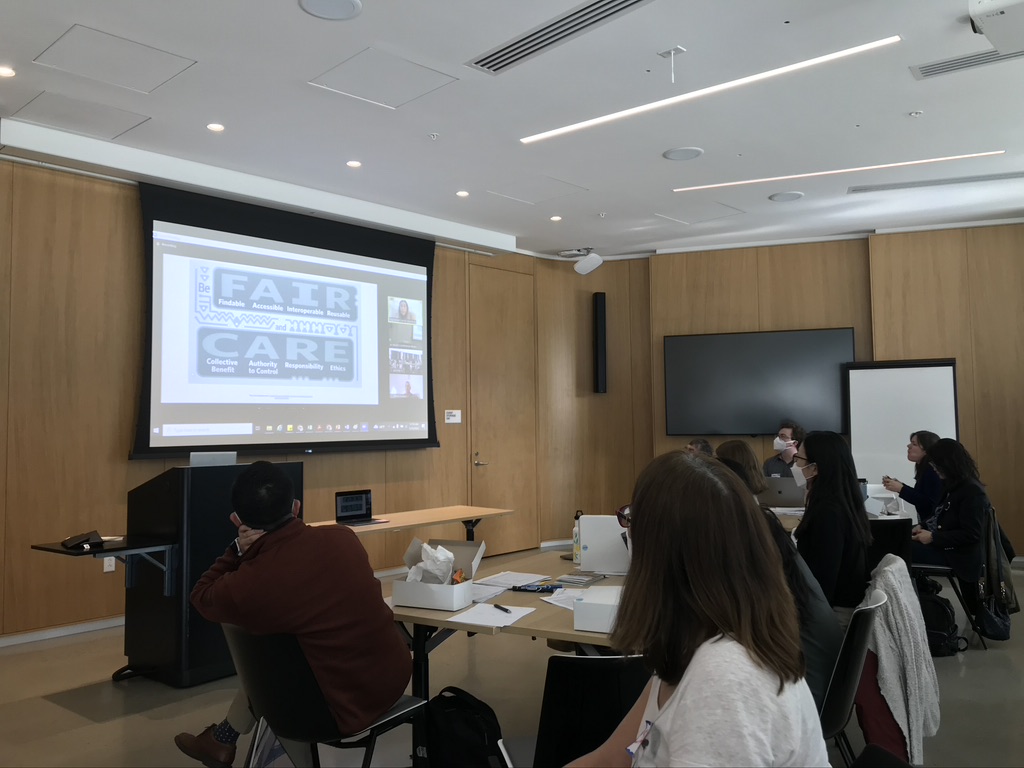 A group of people sitting around a table at the January 2023 All-Hands First Annual AI-READI Workshop